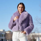 Chloe Faux Fur Jacket in lavender worn by a model outdoors, paired with white pants for a chic winter look.