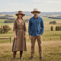 Fluffy Hair Cowboy Hat worn by models in a scenic rural setting with green fields and hills.