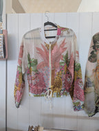 Gauri Zip Jacket featuring a vibrant, patterned design with lively colors and a stylish zip-front for layering.