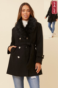 Model wearing the stylish Carson Coat with faux fur collar, double breasted design, and tied belt.
