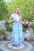 Model wearing the Colombia Midi Skirt blue, showcasing its elegant design and adjustable belt.
